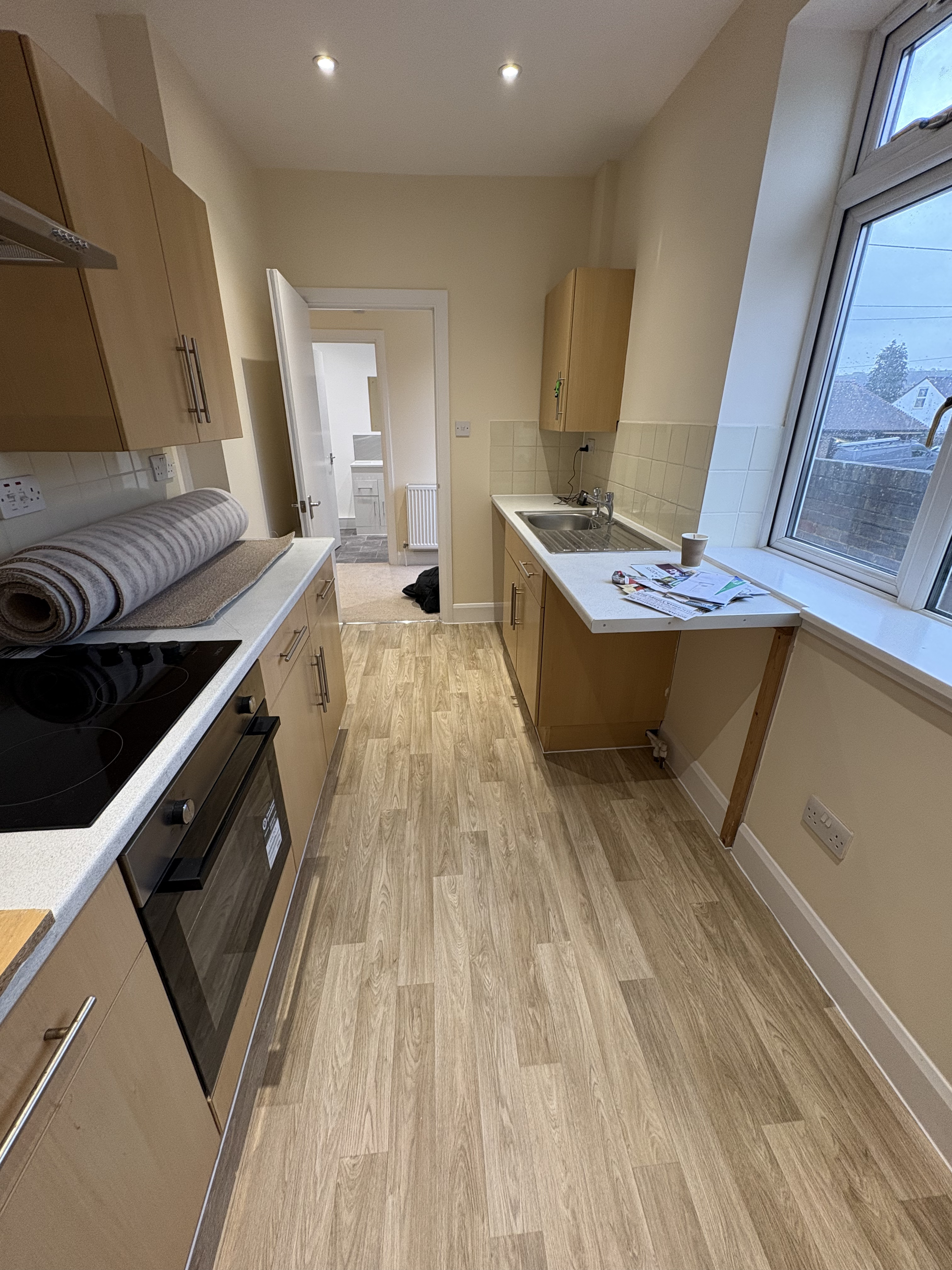 Kitchen vinyl, wood plank effect (after)